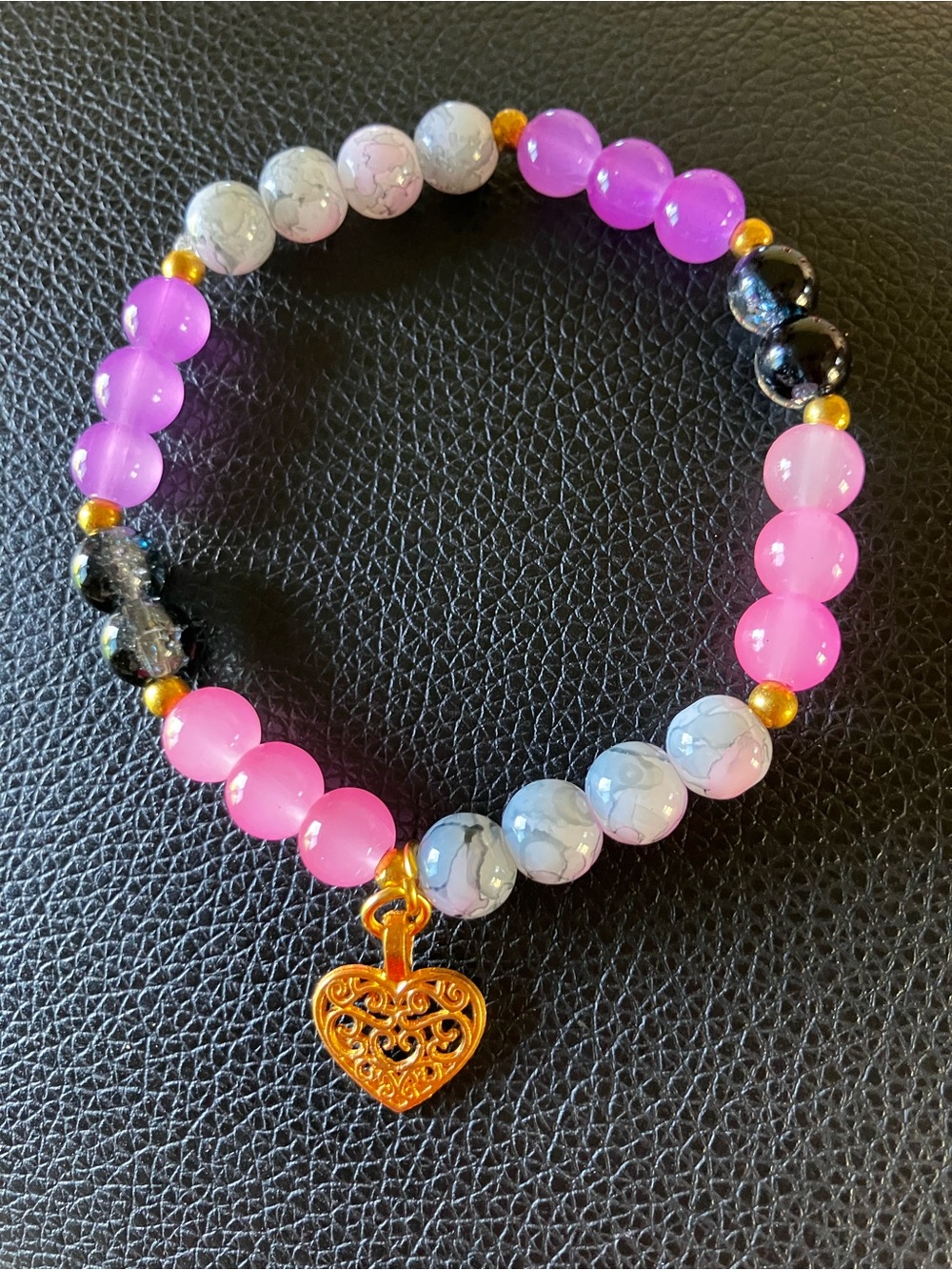 Grey/black,purple,pink glass beaded bracelet with gold accent and heart charm